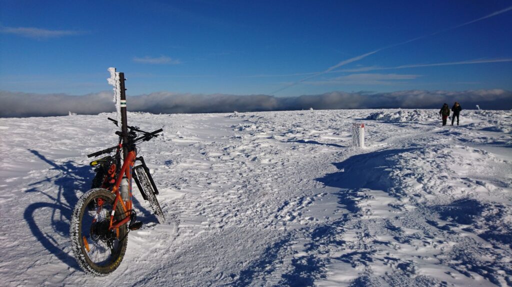 winter biking above the clouds